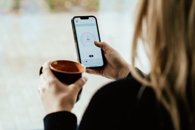 a person holding a cup of coffee