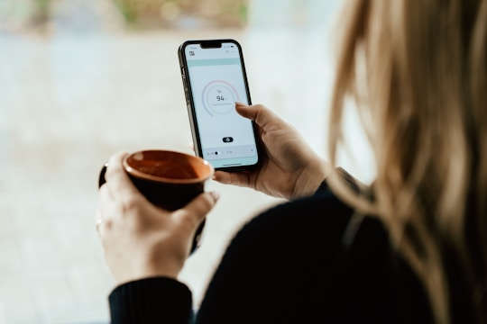 a person holding a cup of coffee