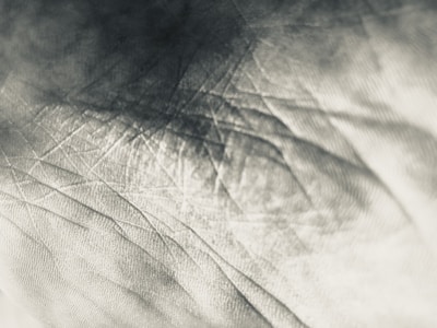 Close-up of textured materials and architectural sketches highlighting the tactile nature of design.