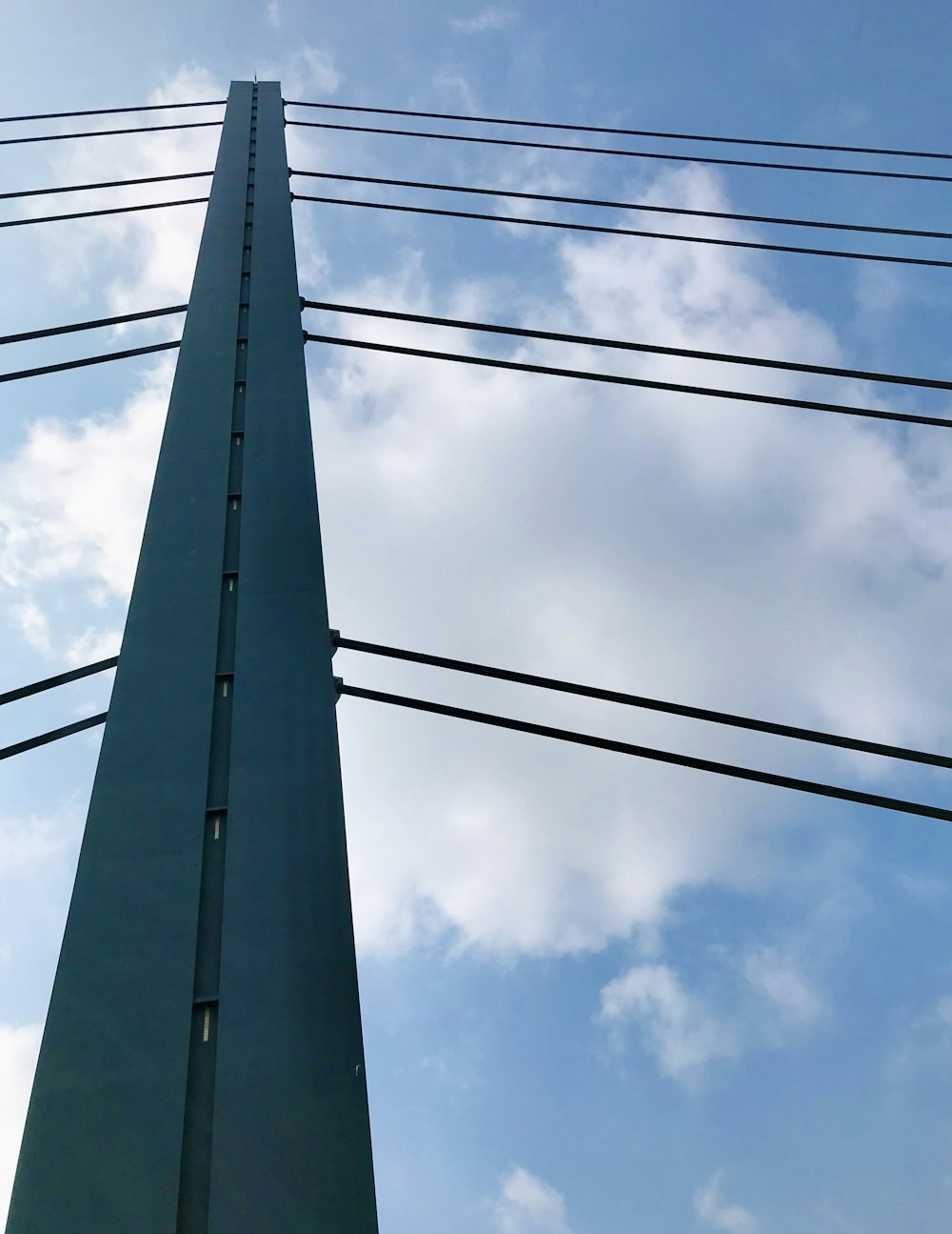 a tall tower with wires