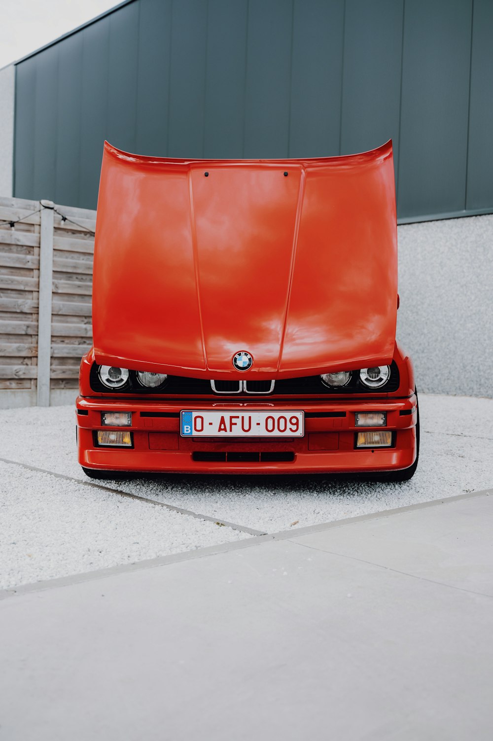 a red car parked in a driveway