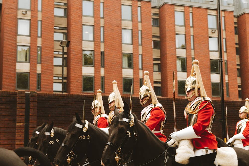 a group of soldiers ride horses