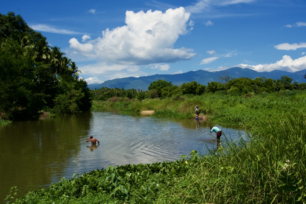 a group of people in a river