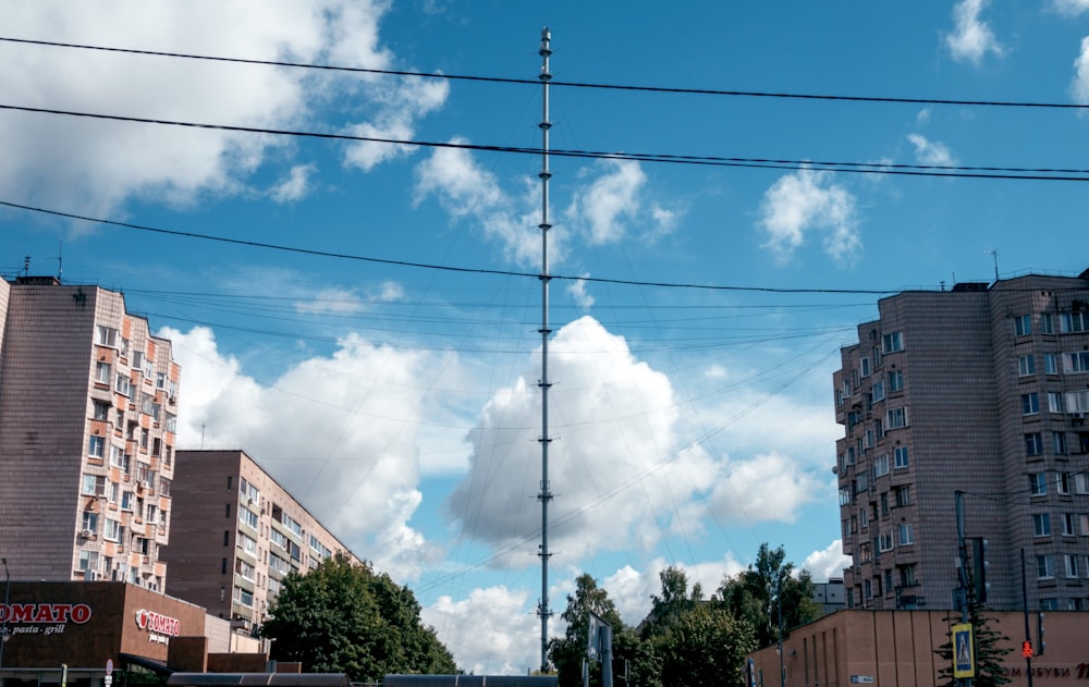 a power line with buildings in the background