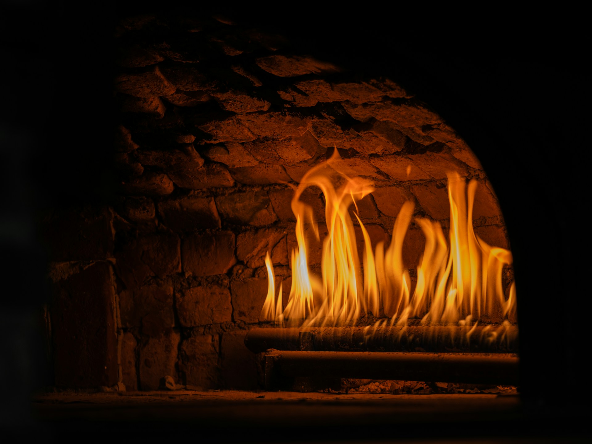 a fire in a brick fireplace