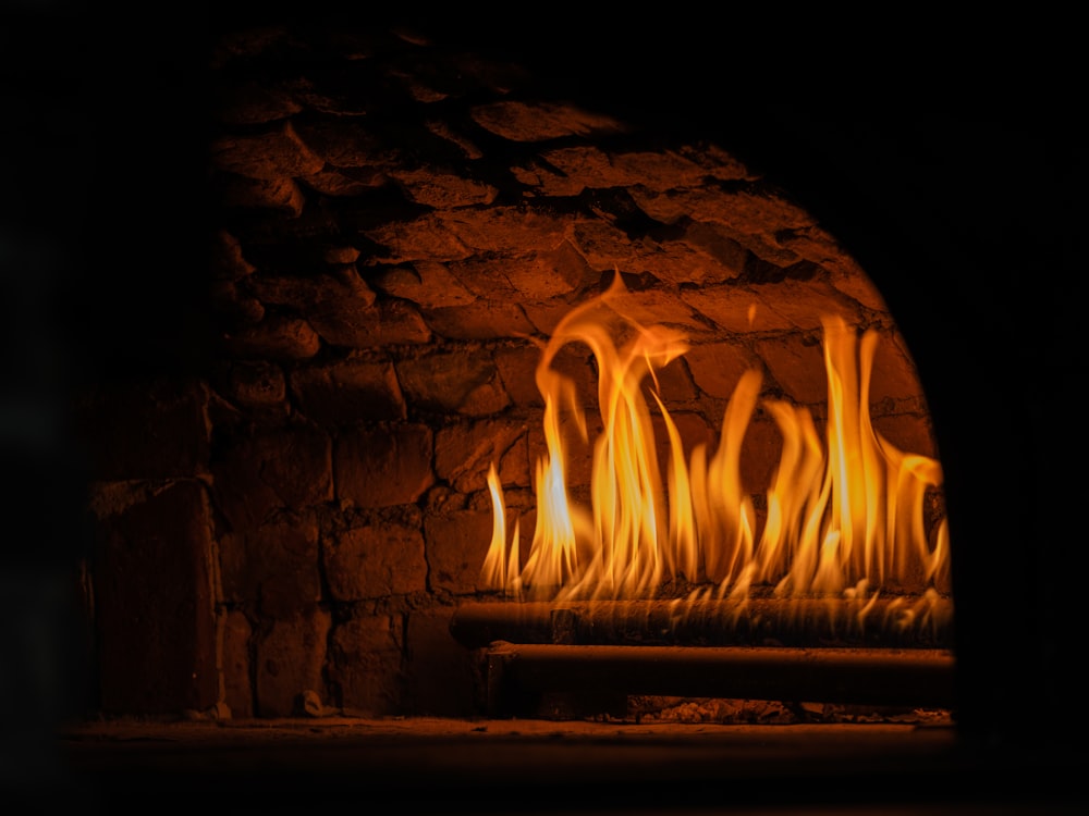 a fire in a brick fireplace