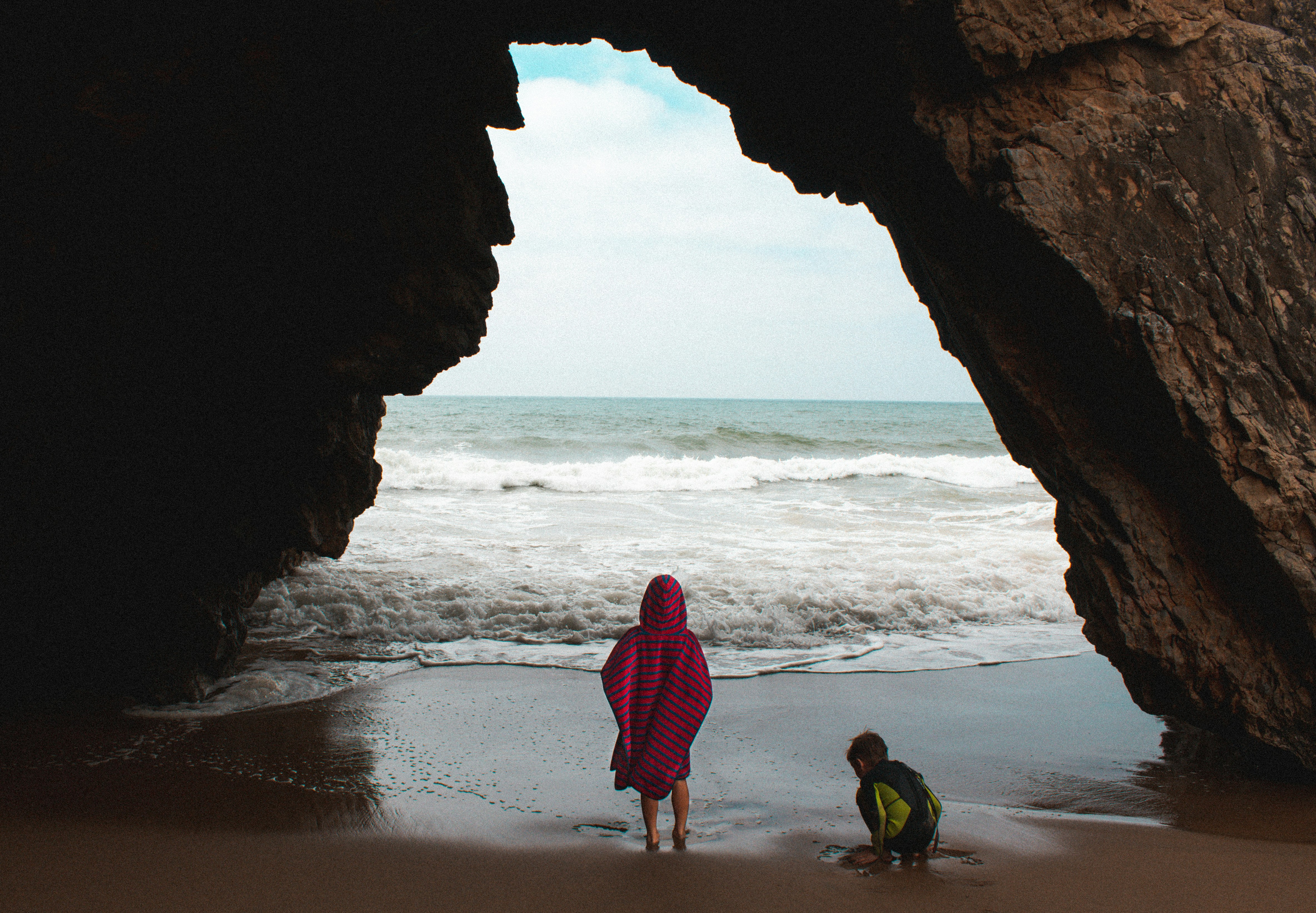 a man and a child on a beach