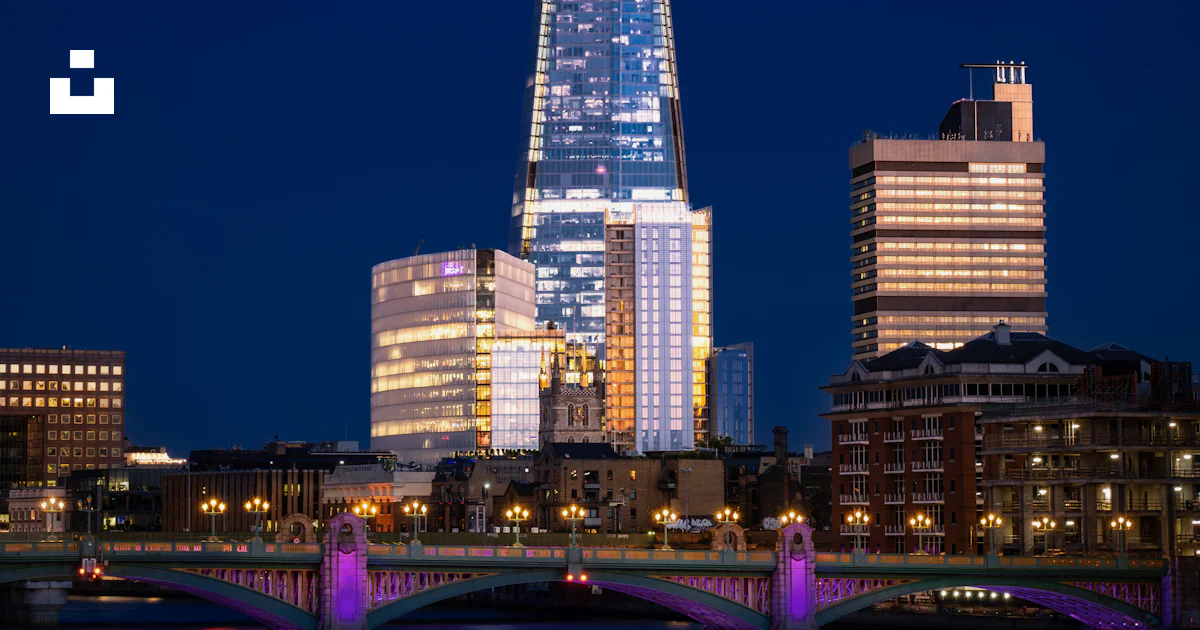 A tall building with lights at night photo – Free London Image on Unsplash