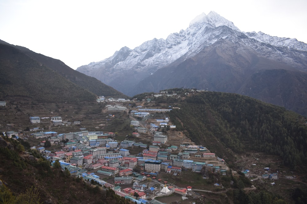 a city in front of a mountain