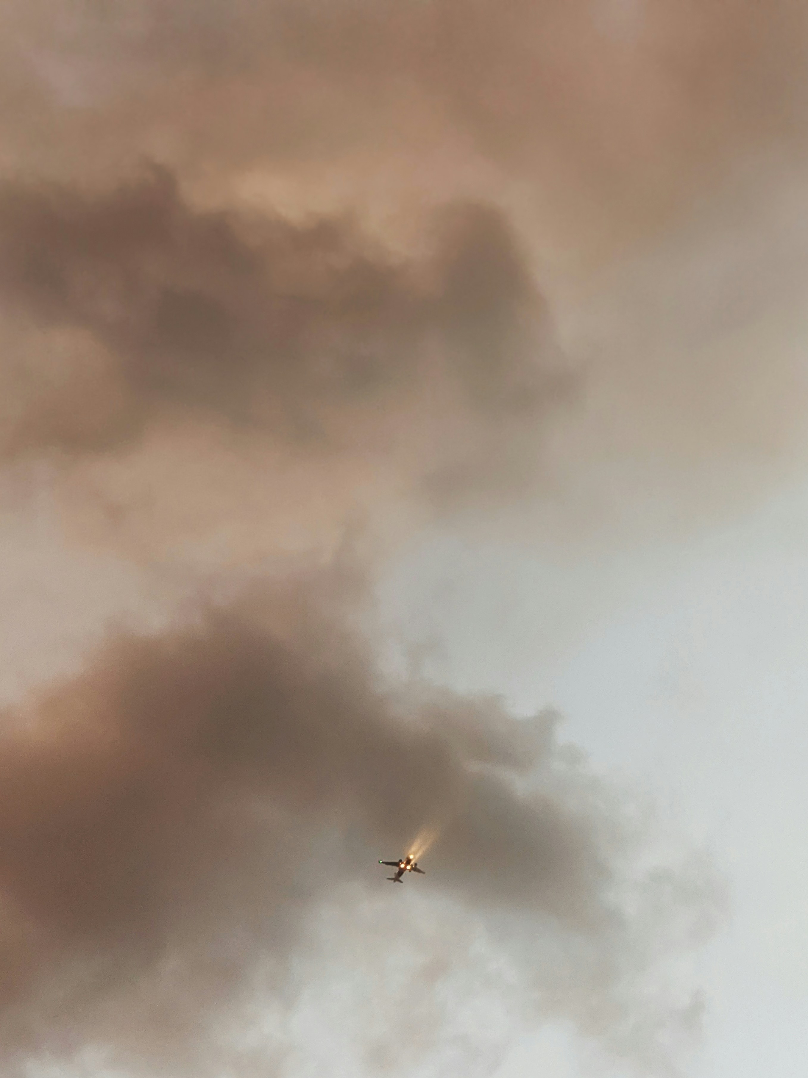 A plane flying through the clouds photo – Free Mobile photography Image ...