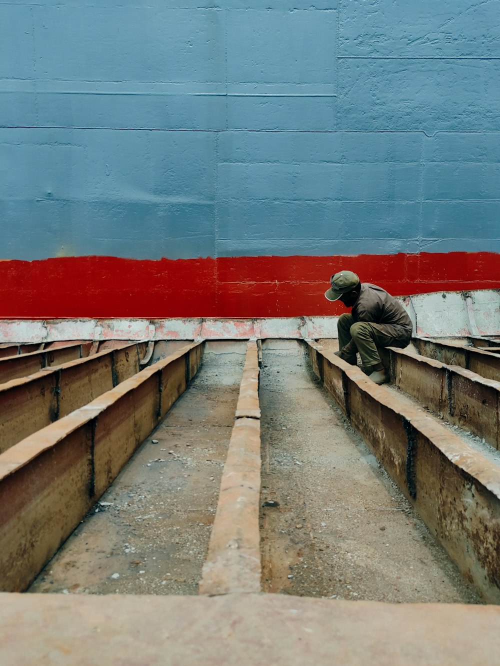 a person sitting on a wall