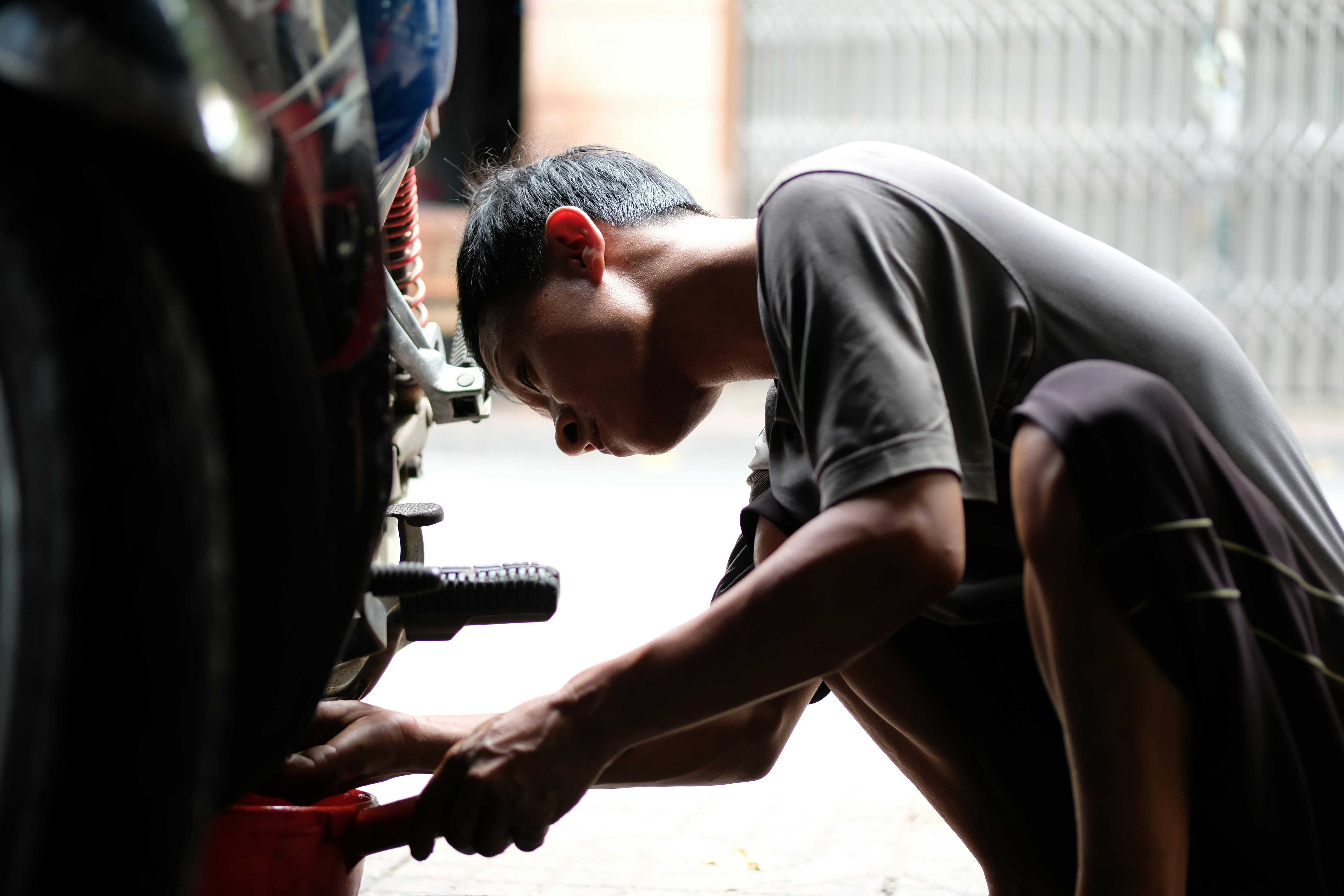 A technician checking garage door balance before installation - local garage door opener installation