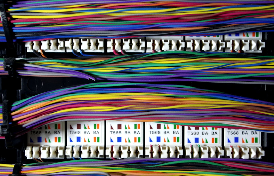 a colorful banner with a group of people on it, Close up of back of network patch panel