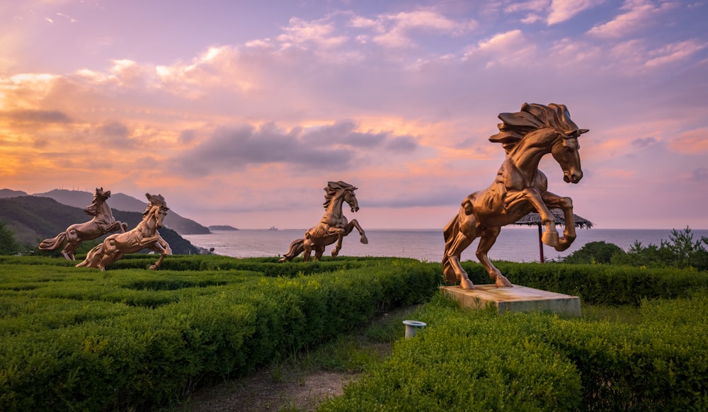 a group of statues of horses