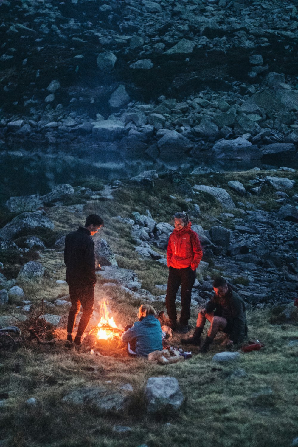 a group of people around a fire