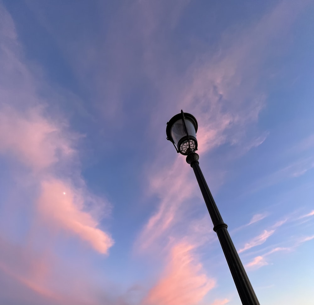 a street light with a blue sky