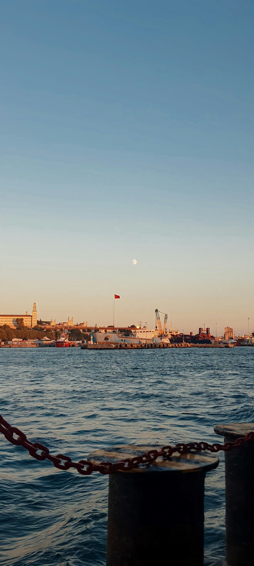 a body of water with a city in the background