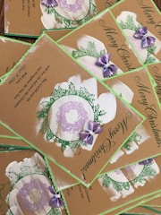 Rustic-themed Christmas card decorations featuring natural elements like pinecones and twine.