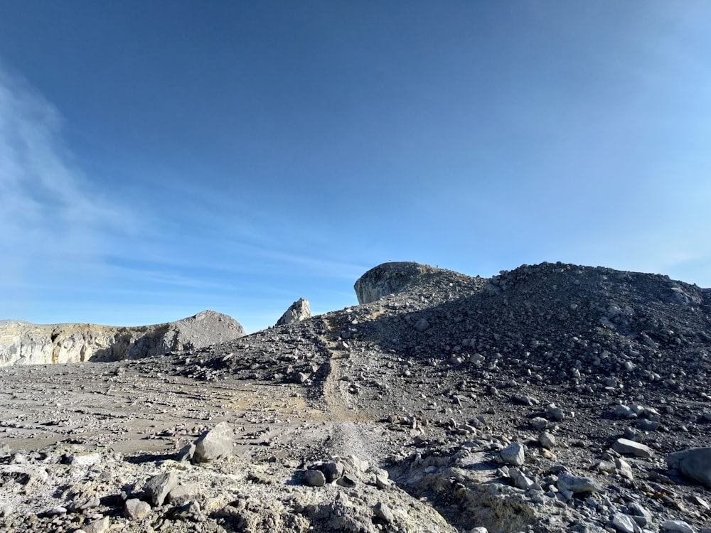 a rocky area with a blue sky