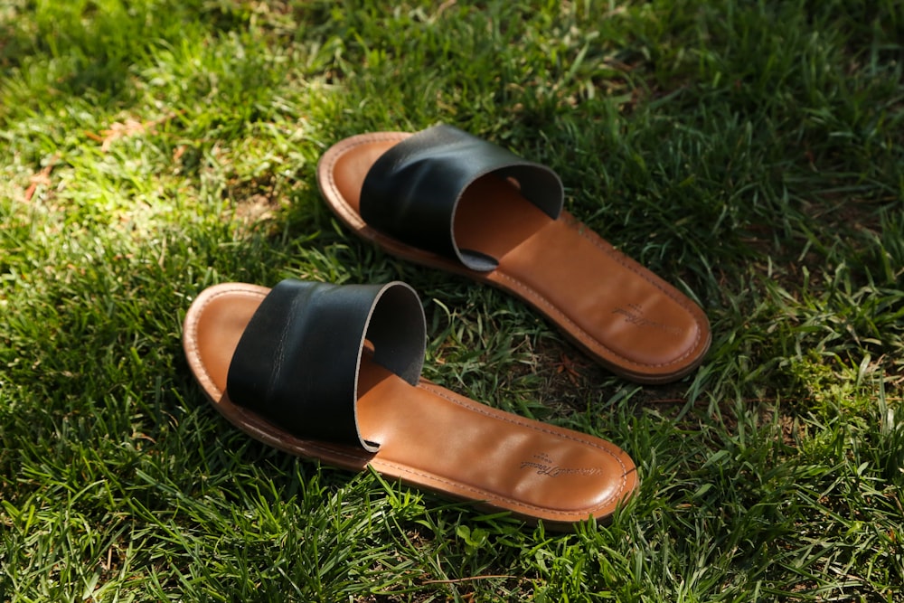 a pair of brown shoes on grass