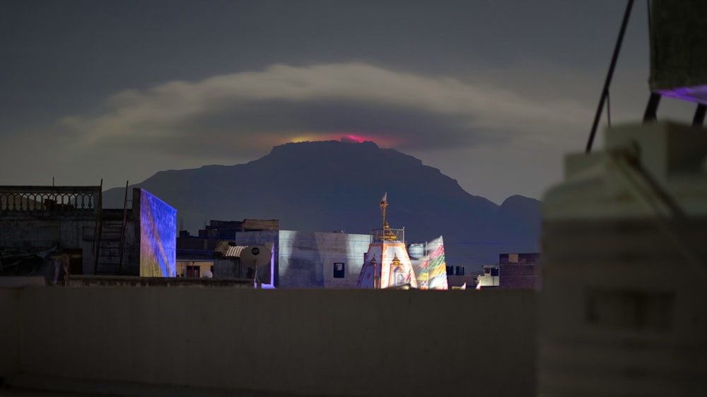 a city with a mountain in the background