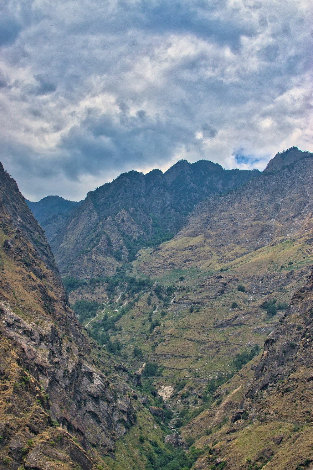 a valley with mountains in the background