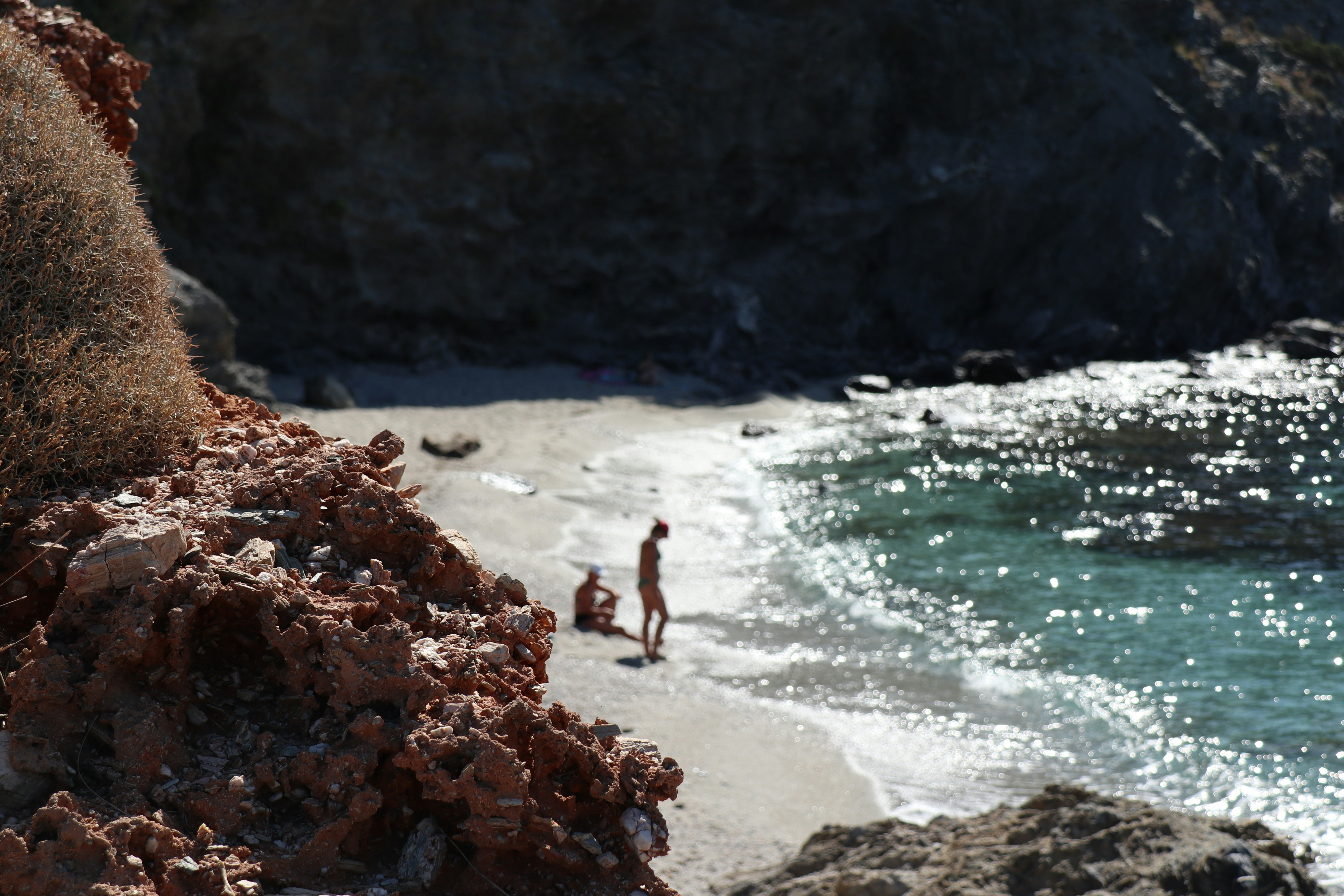 a man and a woman on a beach