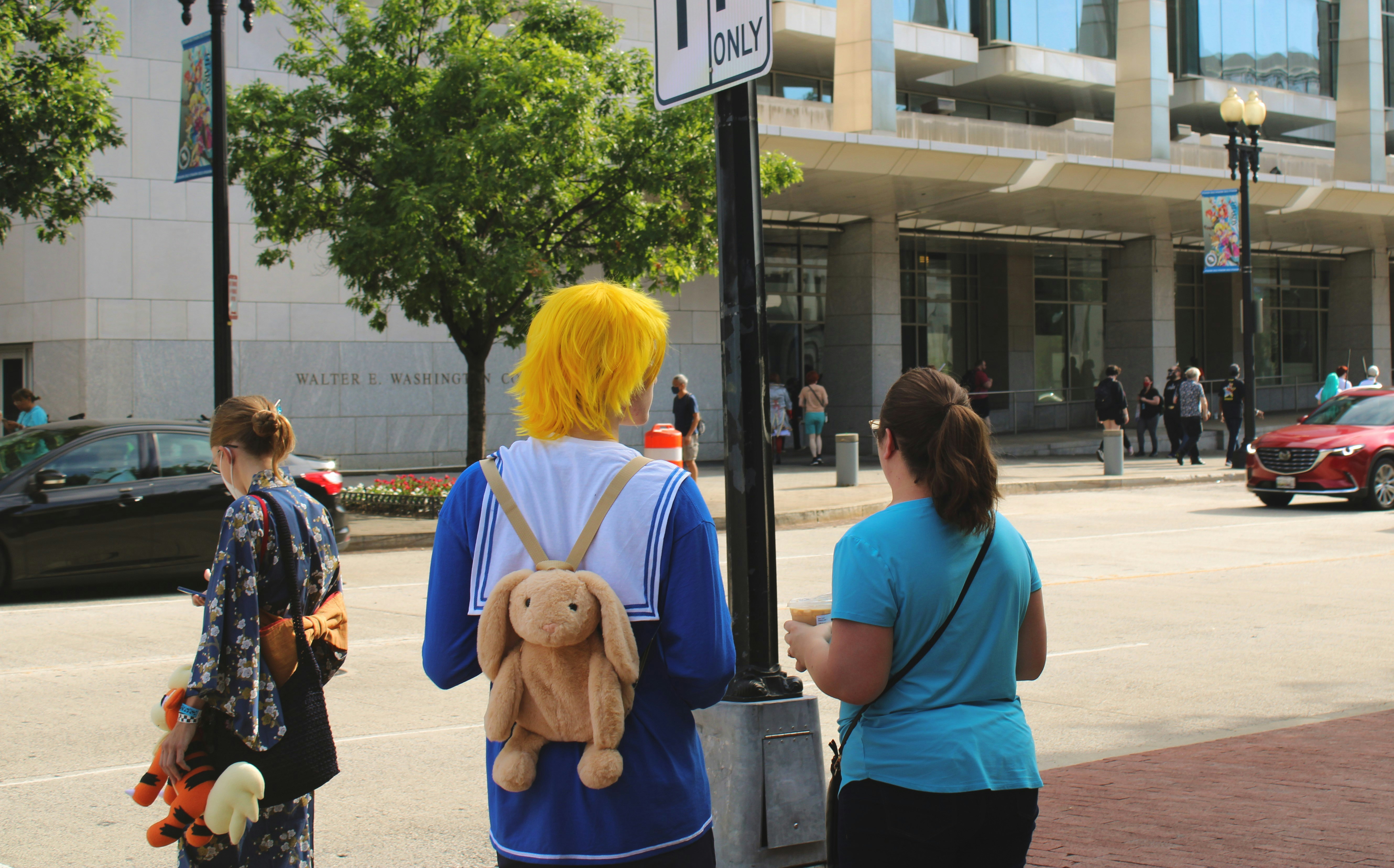 Person holding anime teddy bear