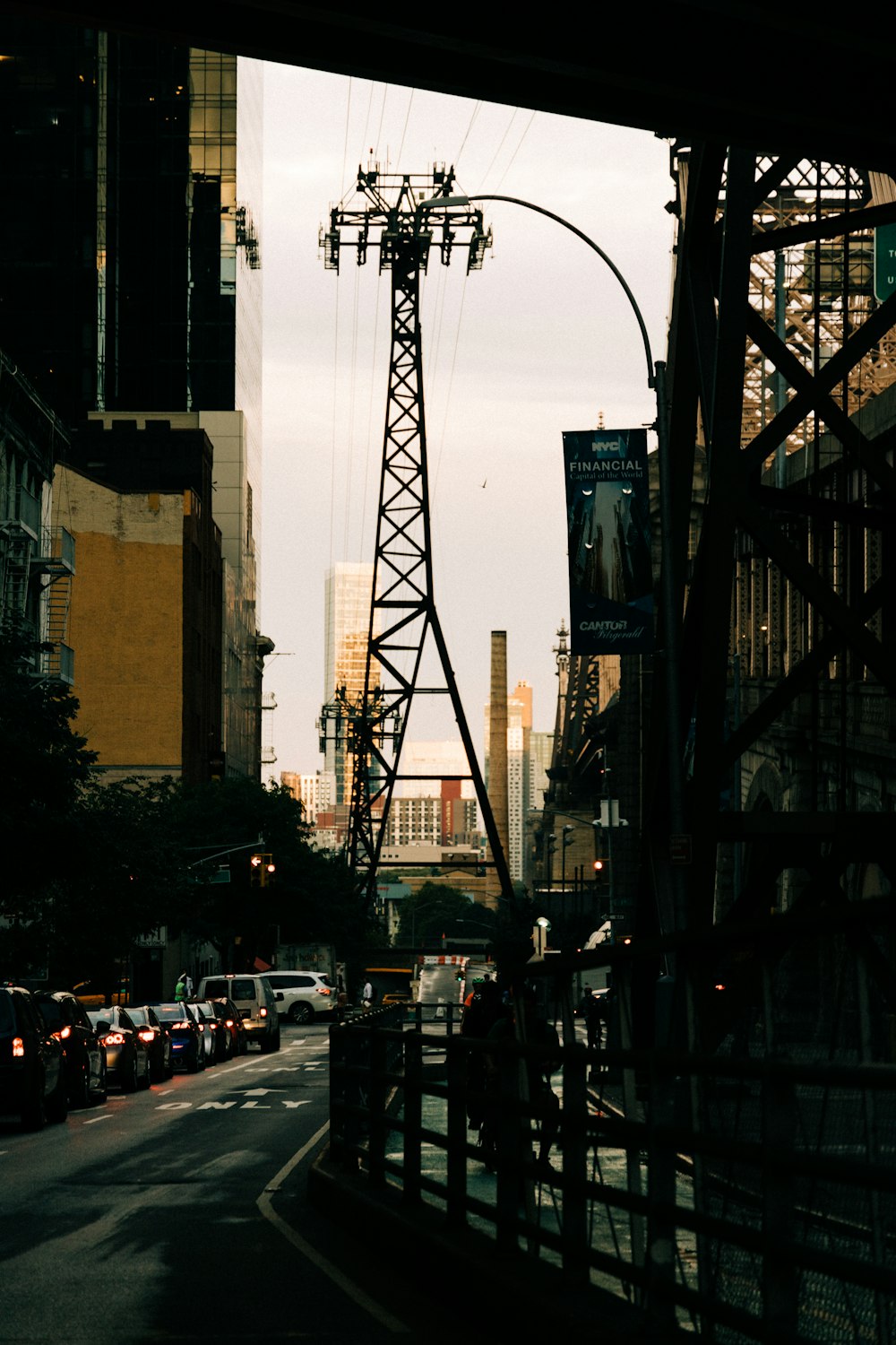 a street with cars and a crane