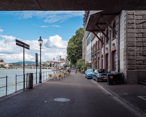 a street with cars and buildings along it