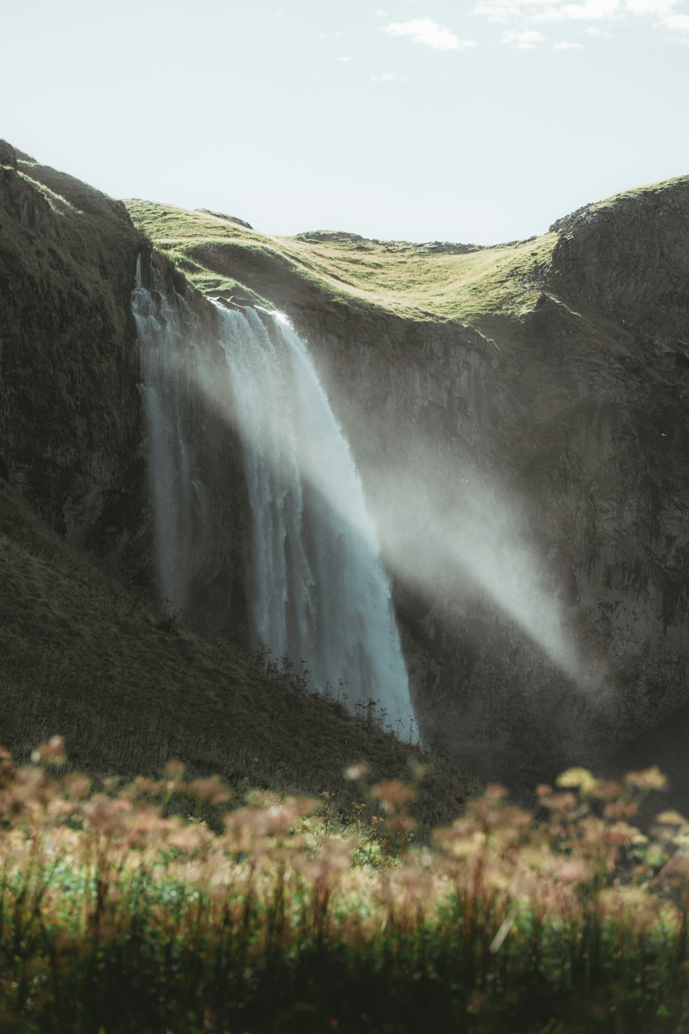 a waterfall over a cliff