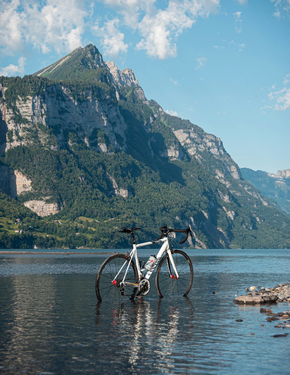 a bicycle parked on a beach