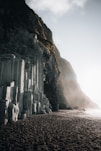 a stone building on a beach