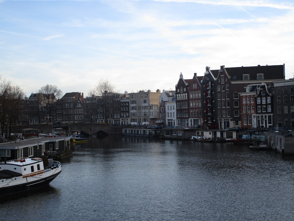 a river with boats and buildings along it