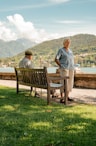 a couple of men sitting on a bench