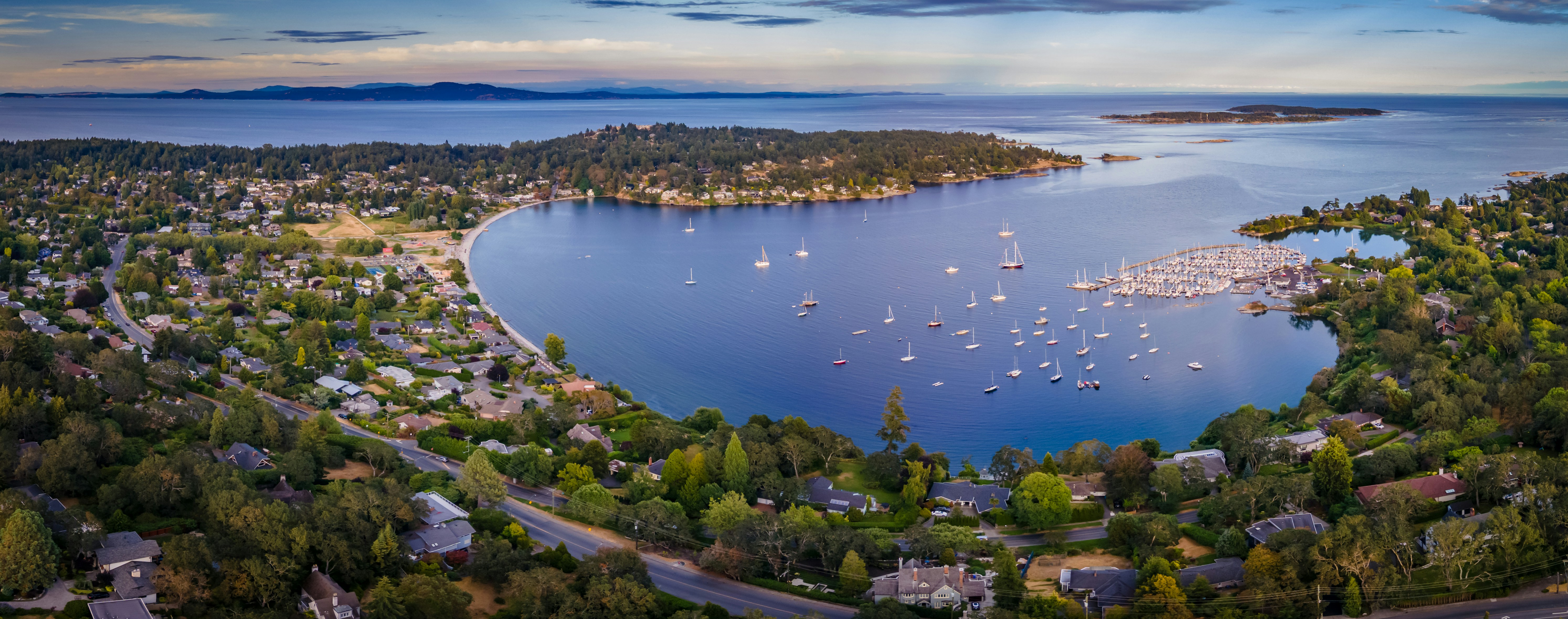 a body of water with boats in it and buildings around it
