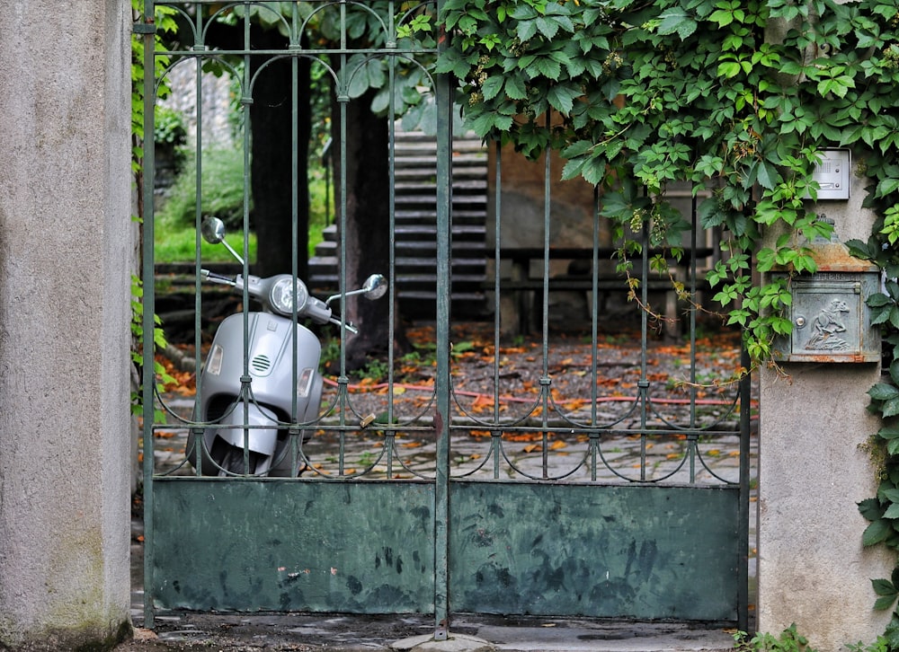a motorcycle parked in a gated area