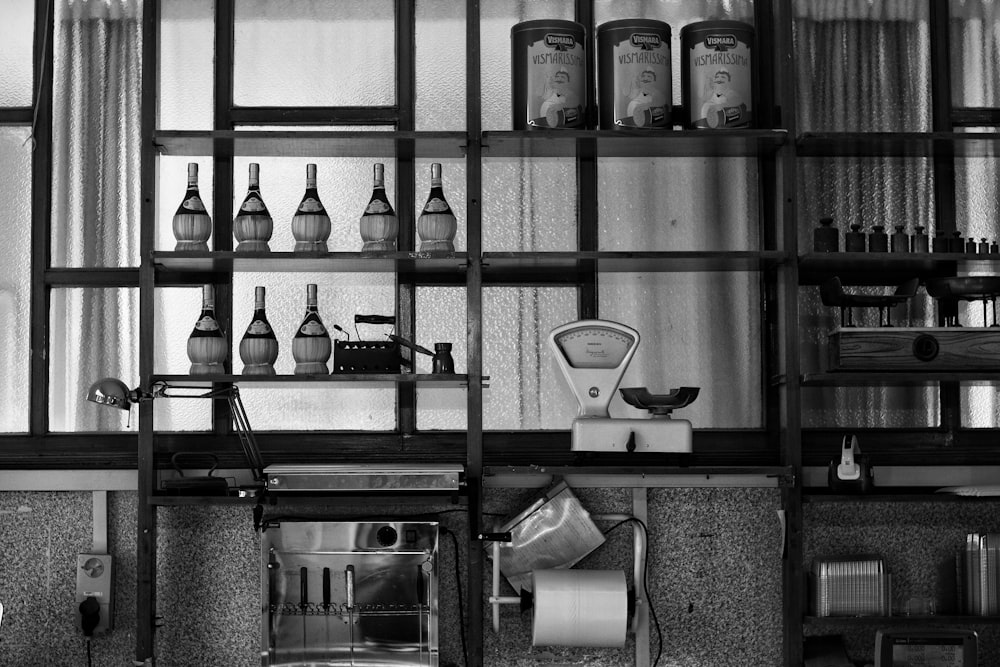 a kitchen with many glass shelves