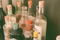 An artistic shot of water bottles with various creative labels in a studio.