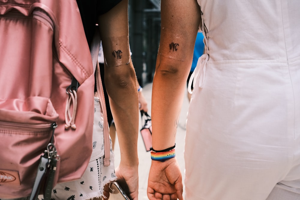 a couple of people with tattoos