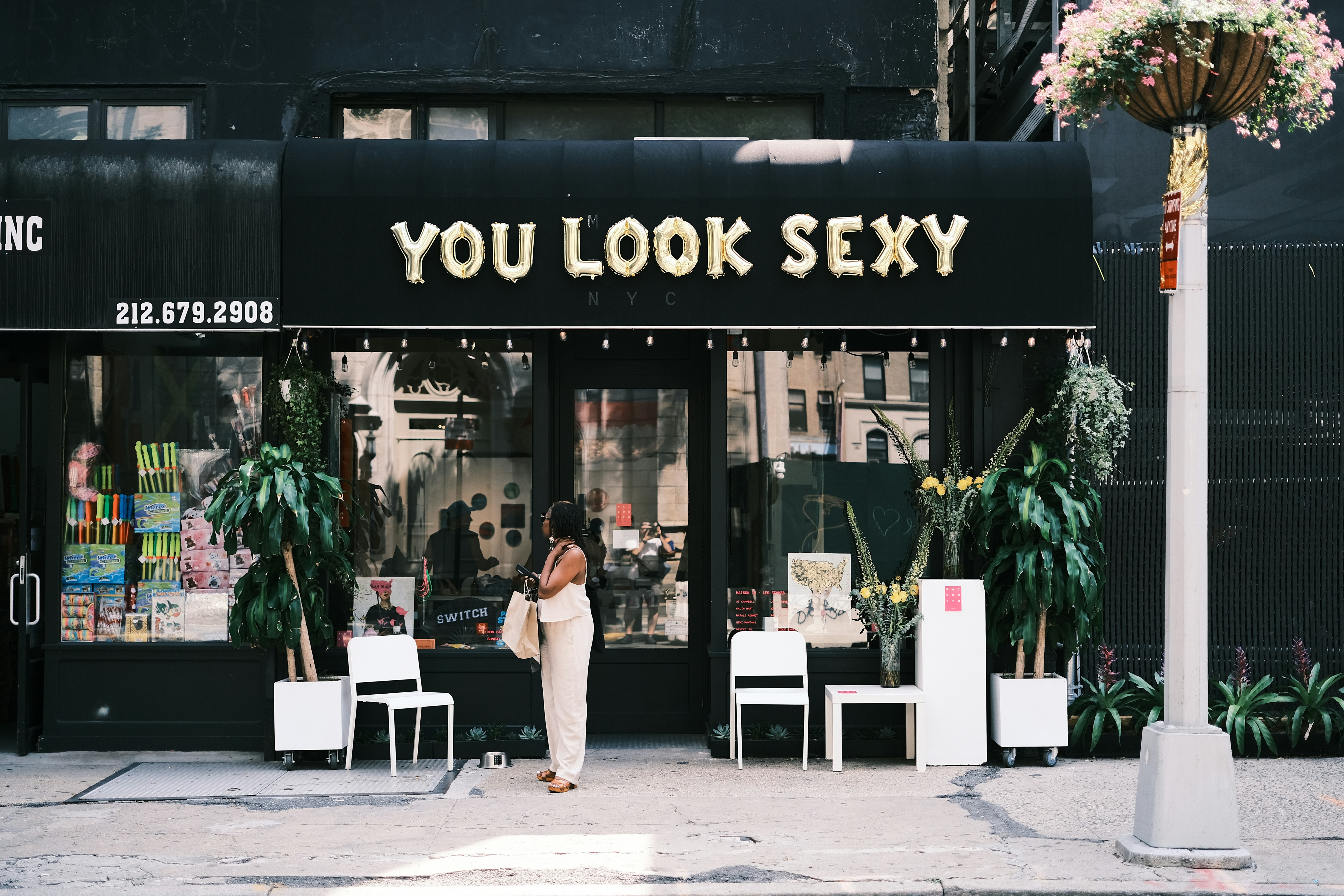 a person standing outside a store