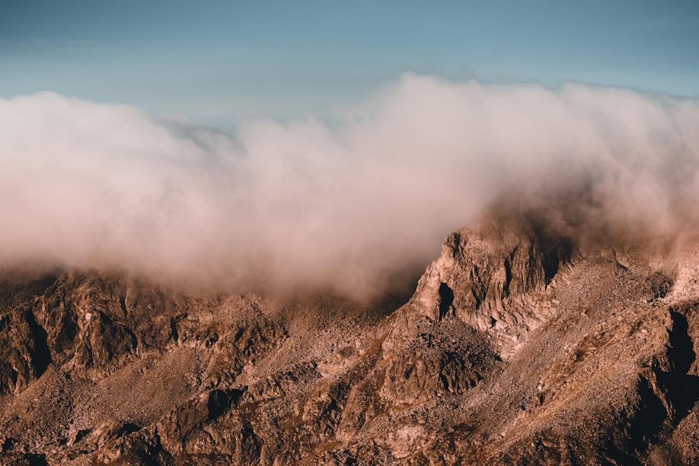 a mountain with clouds