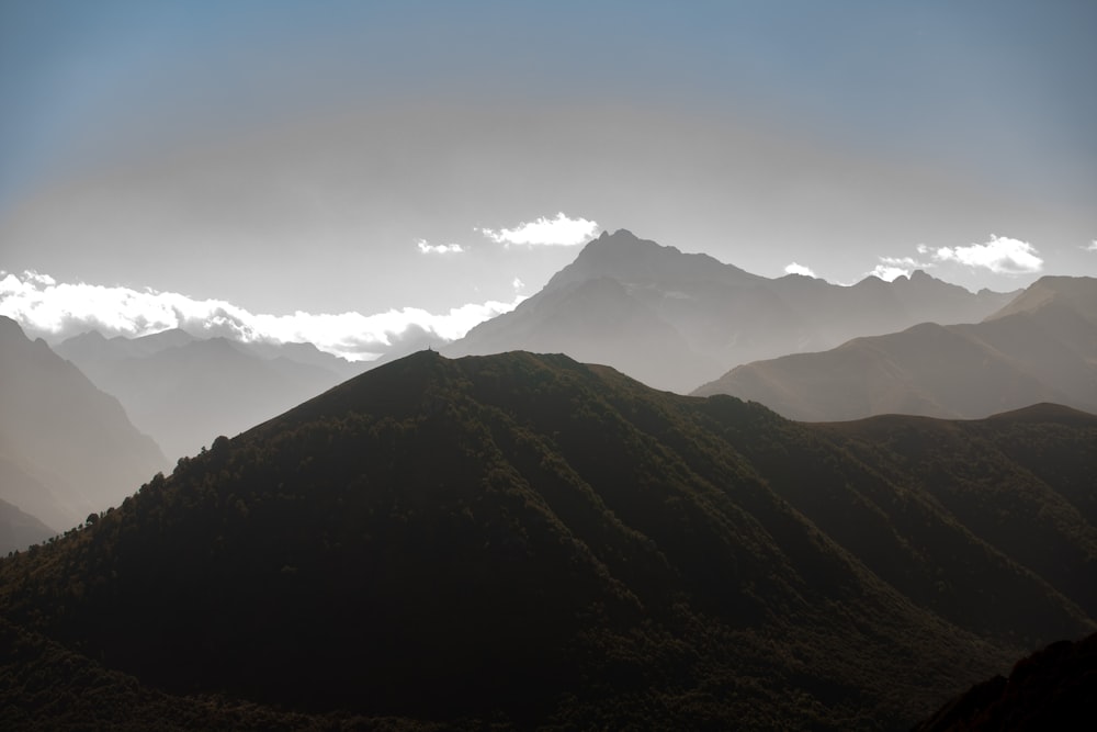 a mountain range with clouds