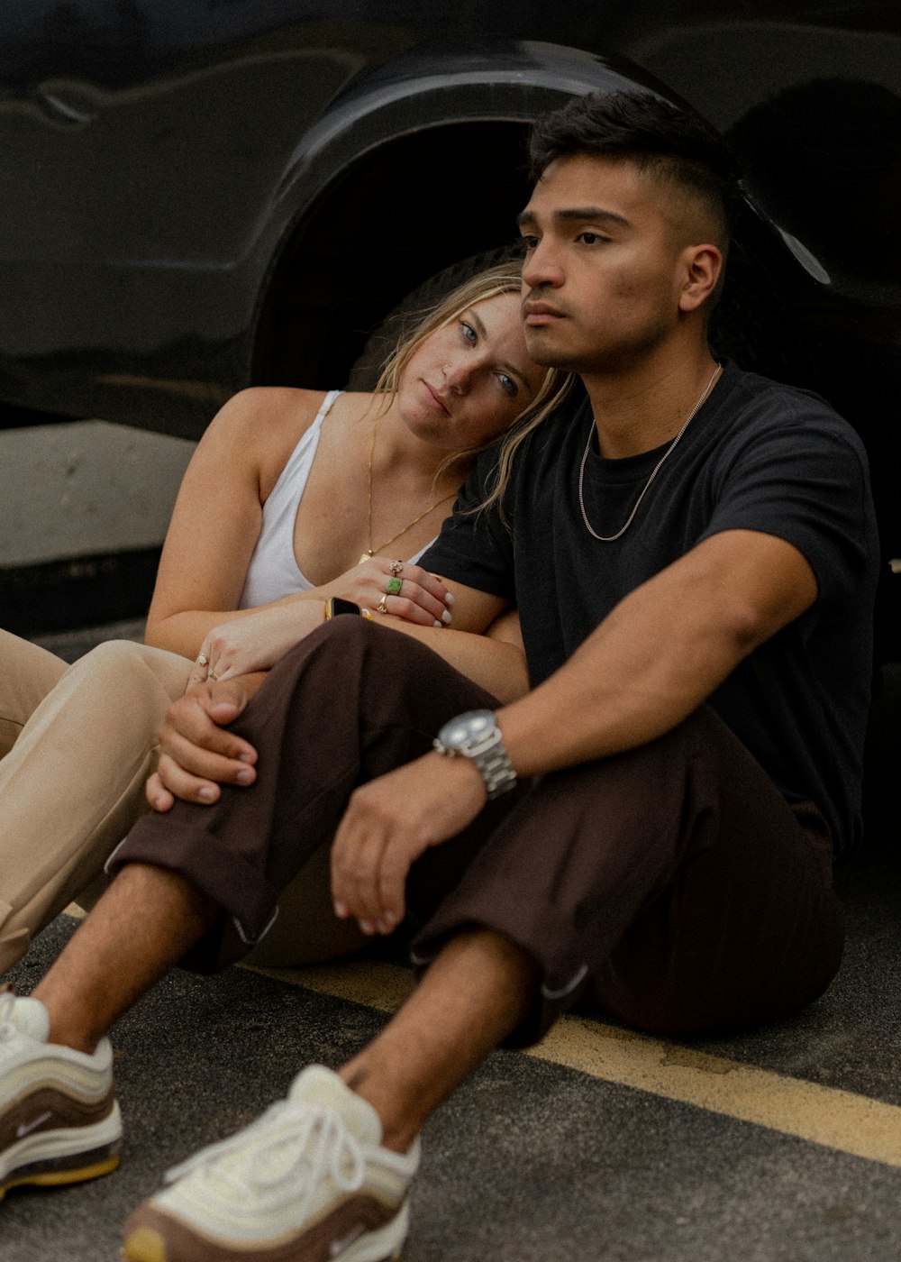 a man and woman sitting in a car