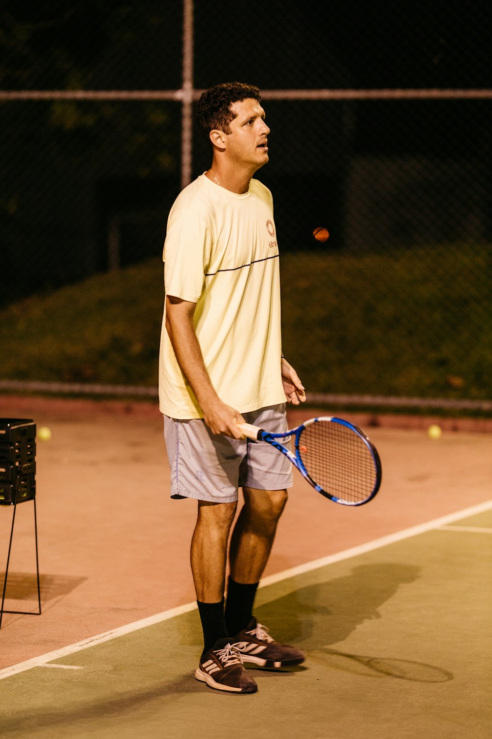 a man holding a tennis racket