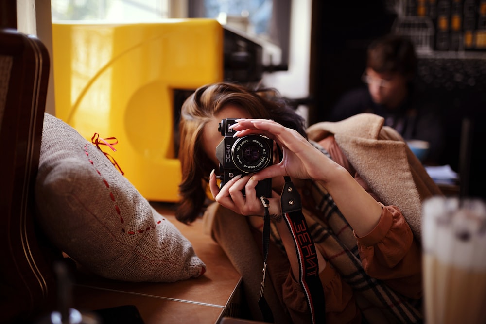 a person holding a camera