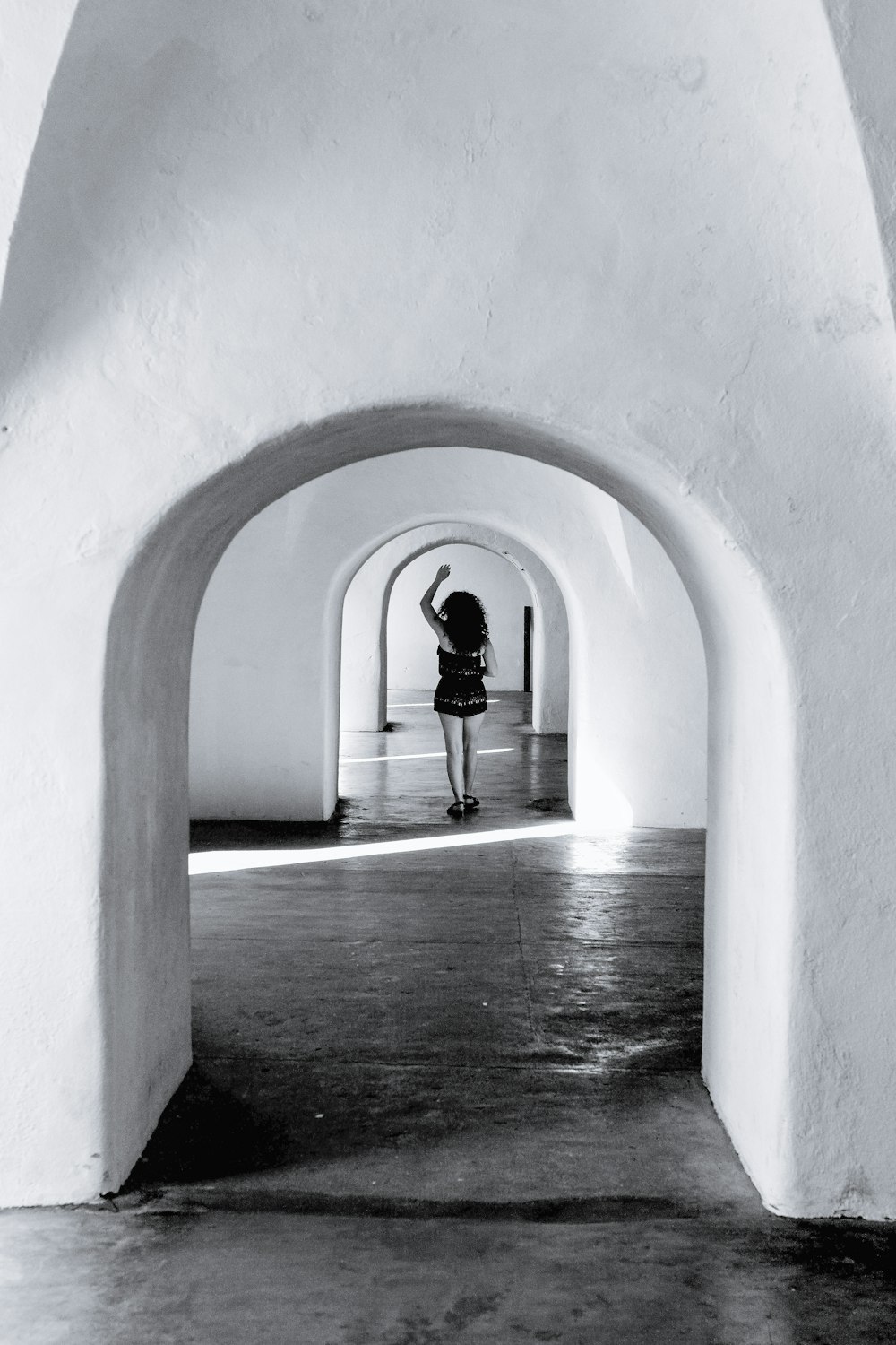 a person standing in a tunnel