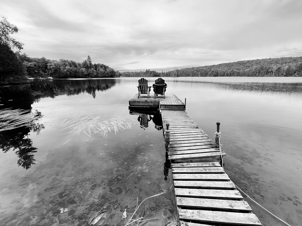 a dock leading to a lake