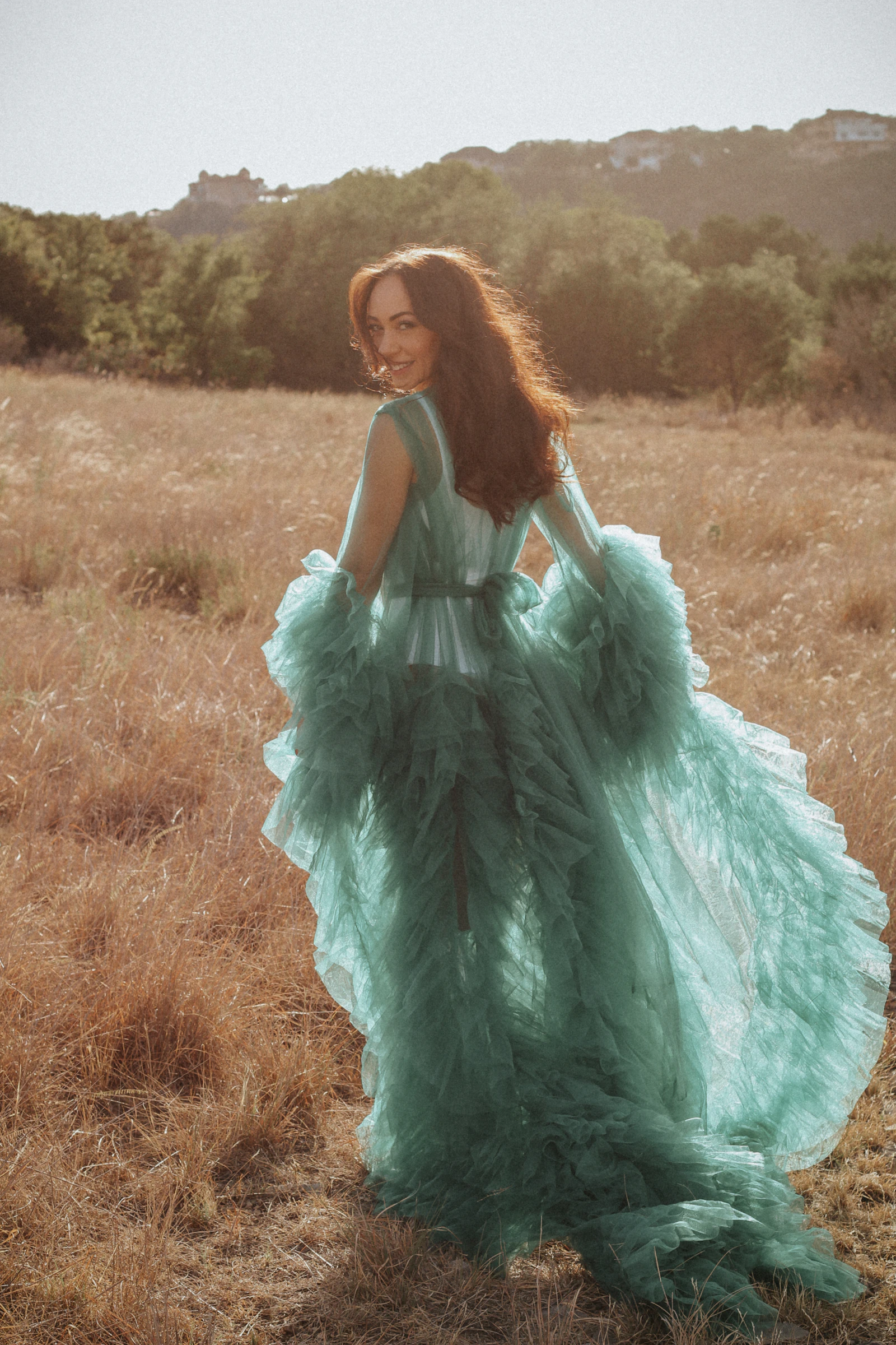 A woman in an elegant chiffon dress