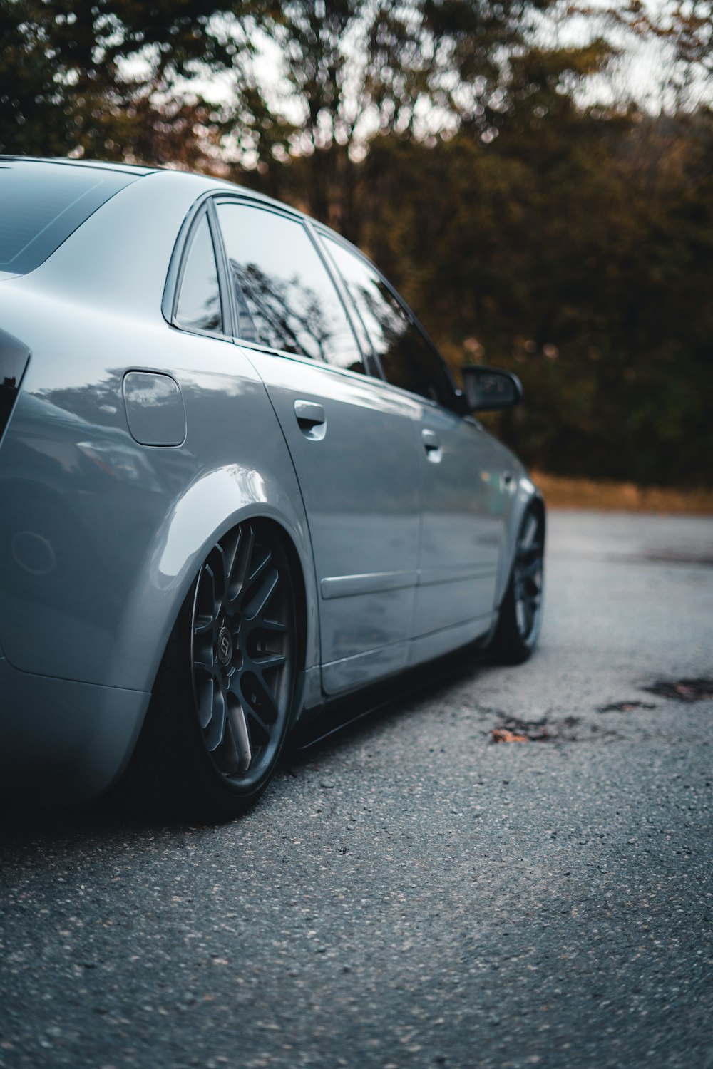 a silver car parked on a road